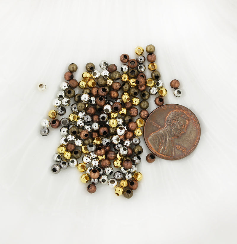 Perles intercalaires rondes 3 mm x 3,2 mm - Assortiment de tons argent, bronze, or et cuivre - 500 perles - FD372