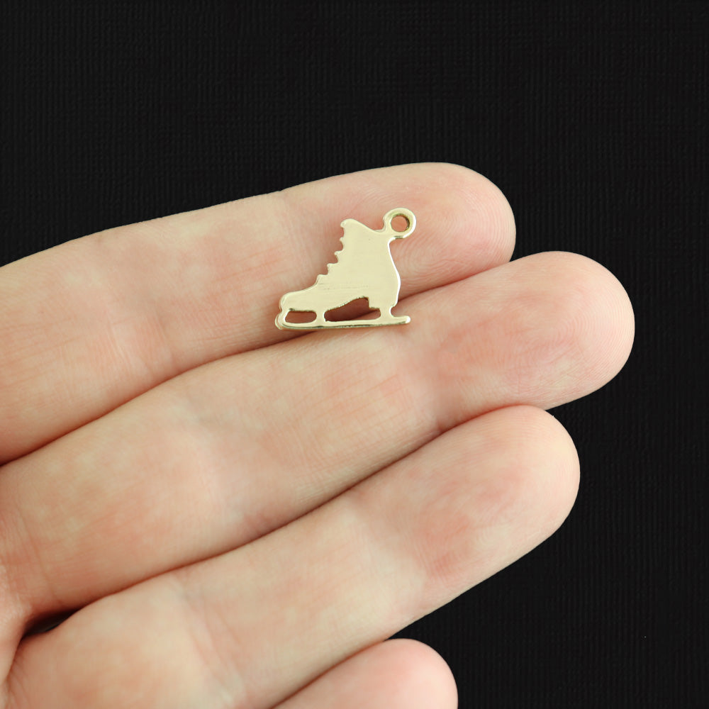 4 breloques en émail doré patin artistique - E263