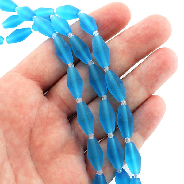 Perles de verre de mer de culture toupies 17 mm x 8 mm - Bleu Pacifique - 1 brin 11 perles - U145