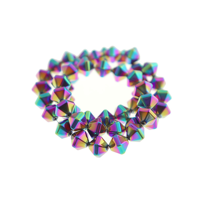 Perles d'hématite synthétique toupie à facettes 10 mm x 8 mm - arc-en-ciel électrolytique - 1 brin 49 perles - BD279