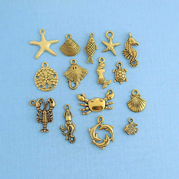 Collection de charmes d'animaux marins ton or antique 15 breloques - COL299