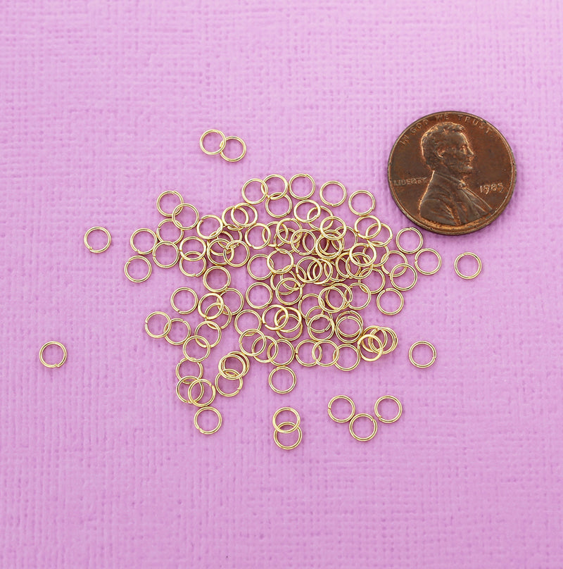 Anneaux en acier inoxydable doré 4 mm x 0,5 mm - Calibre 24 ouvert - 100 anneaux - SS049