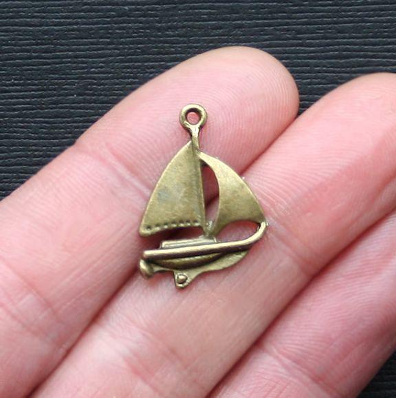 8 Sailboat Antique Bronze Tone Charms - BC851