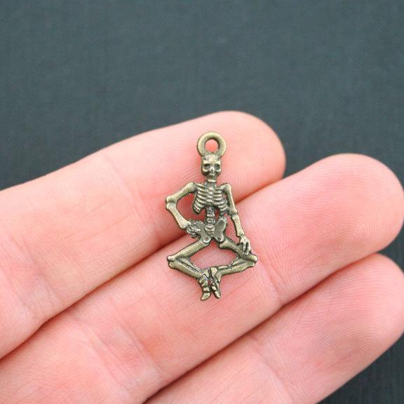 8 Skeleton Antique Bronze Tone Charms 2 Sided - BC102