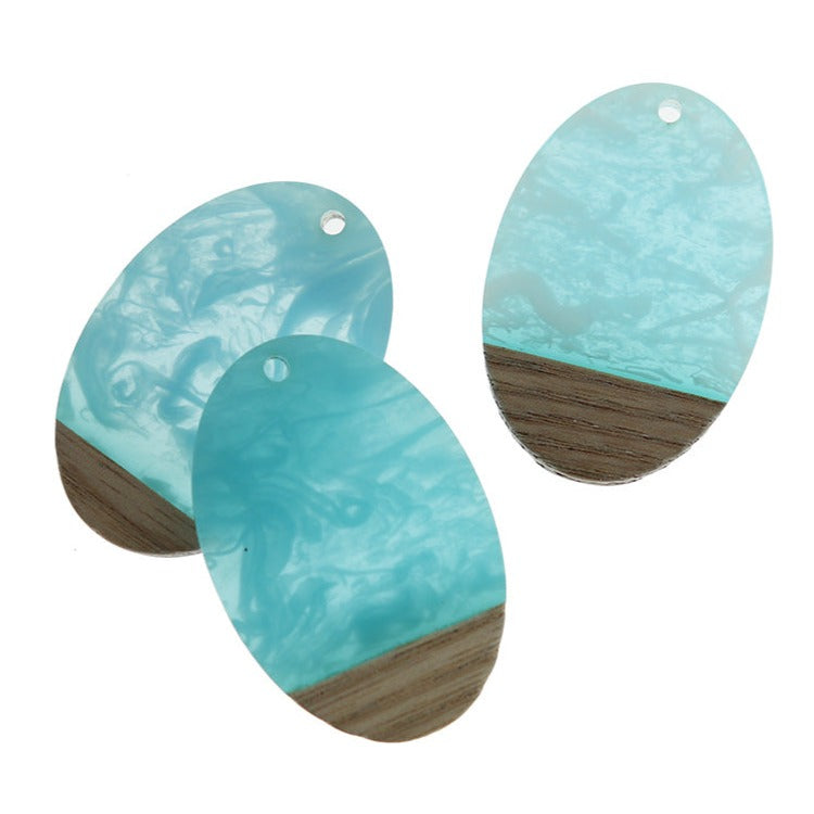 2 Oval Natural Wood and Turquoise Swirled Resin Charms 38mm - WP489