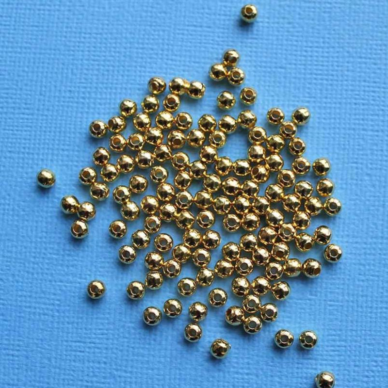 Perles intercalaires rondes 4mm x 4mm - ton or - 500 perles - FD234