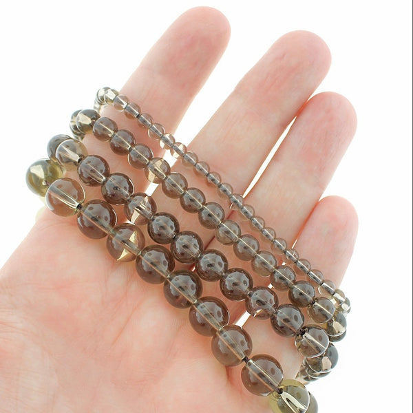 Perles rondes de pierres précieuses de quartz naturel 4 mm - 10 mm - Choisissez votre taille - Brun fumé - 1 brin complet de 15,5" - BD1867