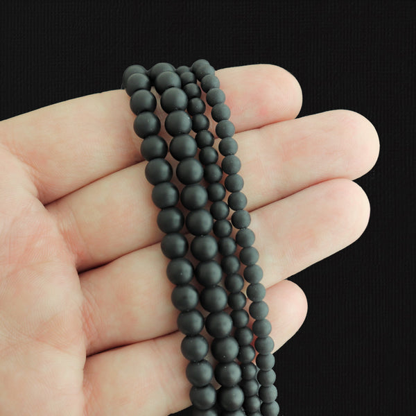 Perles rondes en pierre synthétique 4 mm ou 6 mm - Choisissez votre taille - Noir - 1 brin complet - BD2577