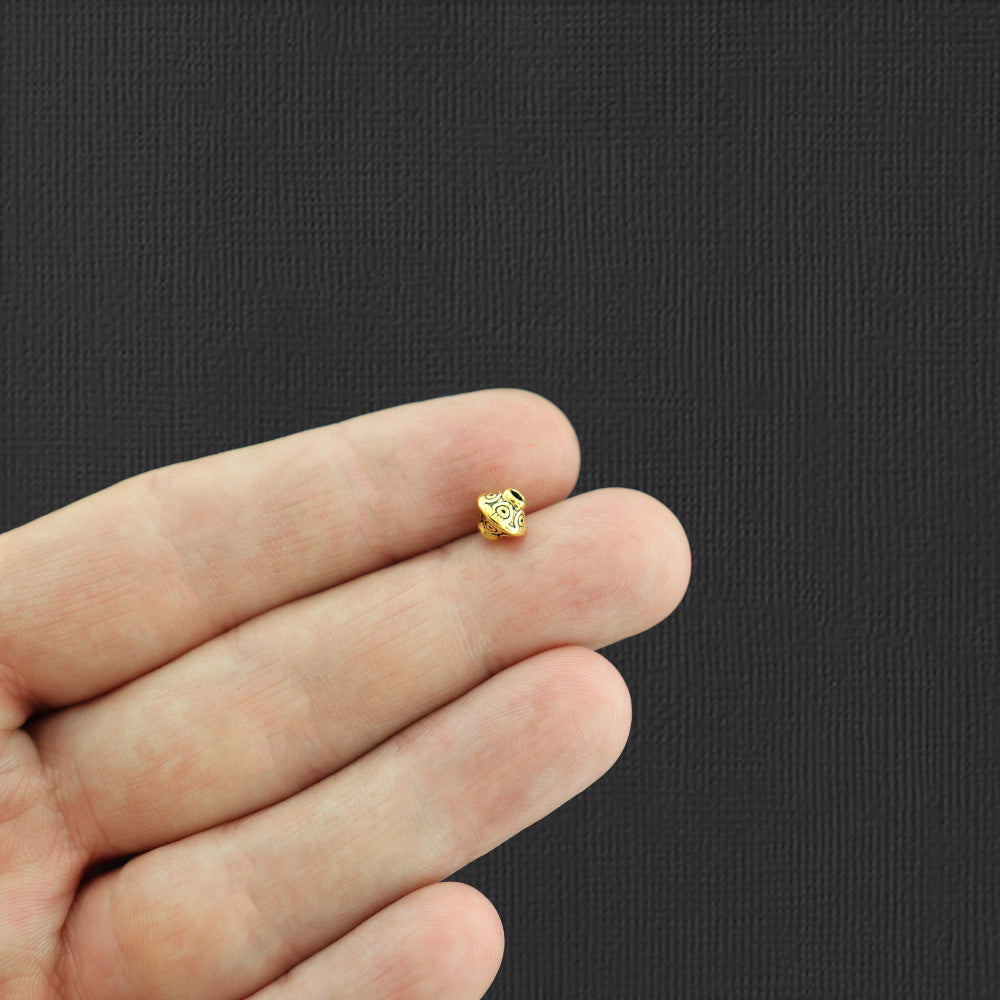 Perles intercalaires toupies 6,4 mm x 7,5 mm - ton or antique - 25 perles - GC850