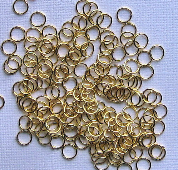 Anneaux dorés 6 mm x 0,9 mm - Calibre 19 ouvert - 1000 anneaux - J037B