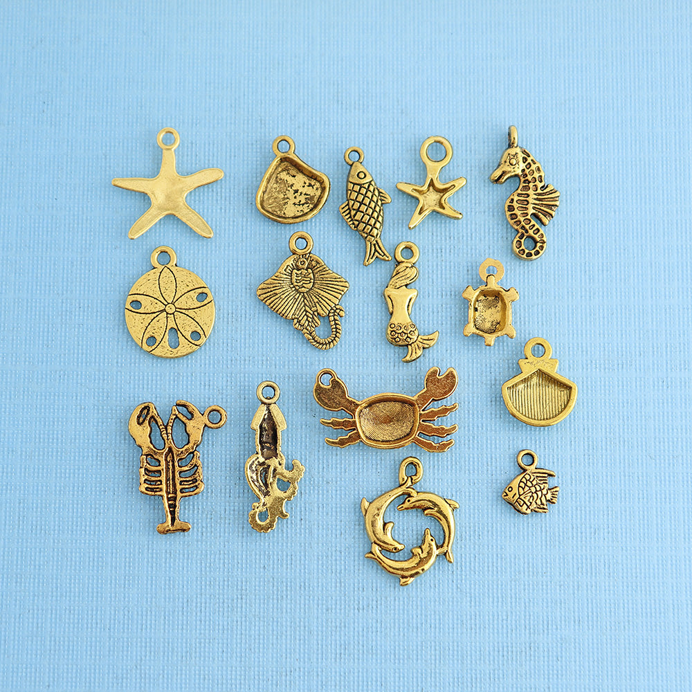 Collection de charmes d'animaux marins ton or antique 15 breloques - COL299