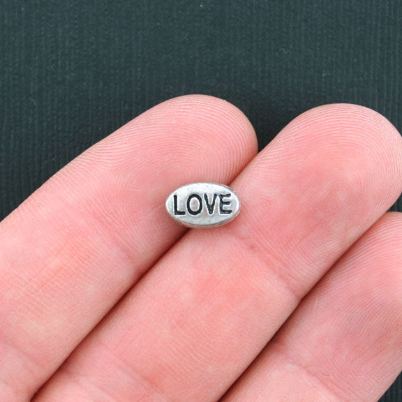 Perles intercalaires ovales 5 mm x 9 mm - ton argent - 12 perles - SC3564