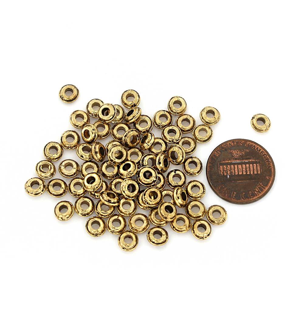 Perles intercalaires rondes 5,5 mm x 2,5 mm - ton or - 25 perles - GC1045