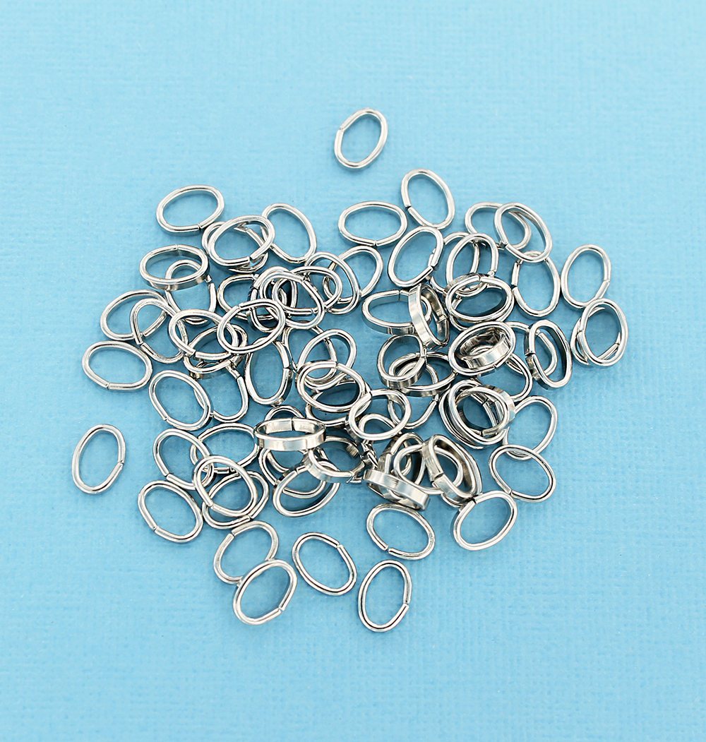 Anneaux ovales argentés 10 mm x 7 mm, 2 mm x 1 mm - Calibre ouvert 12 x 18 - 100 anneaux - J080