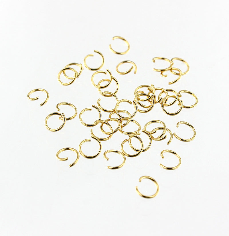 Anneaux en acier inoxydable doré 5 mm x 0,6 mm - Calibre 23 ouvert - 200 anneaux - J162