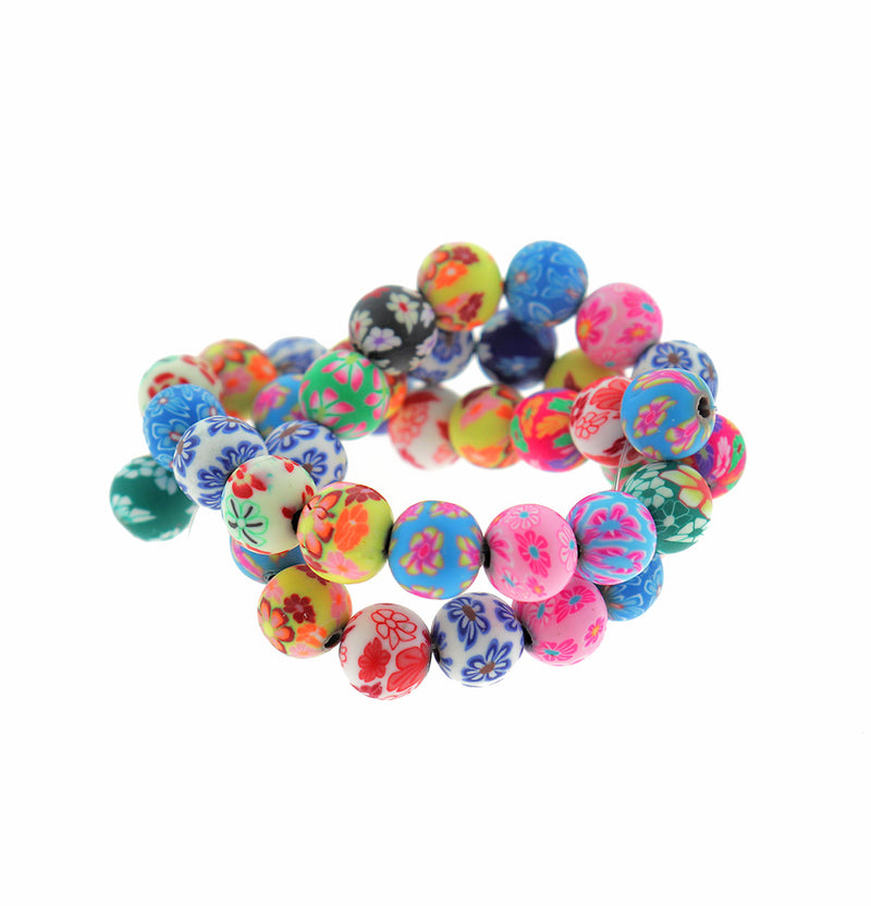Perles rondes en pâte polymère 10 mm - Design assorti - 1 brin 38 perles - BD1887