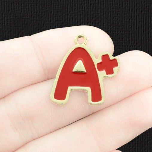 4 breloques en émail doré de l'école A+ - E706