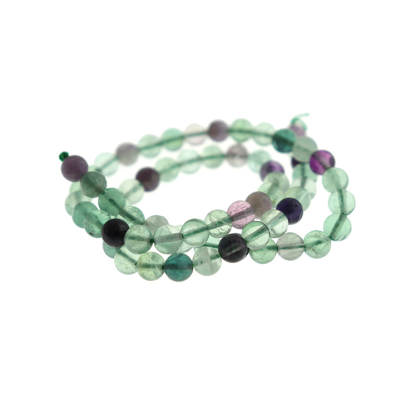 Perles rondes en fluorite naturelle 6 mm - violets, bleus et verts - 1 brin 61 perles - BD1665