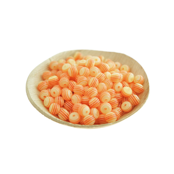 Perles rondes en résine 8mm - Rayure orange saumon - 100 perles - BD397