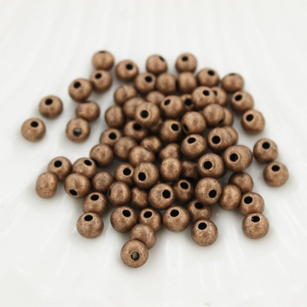 Perles d'espacement rondes 5 mm - ton cuivre antique - 100 perles - FD417