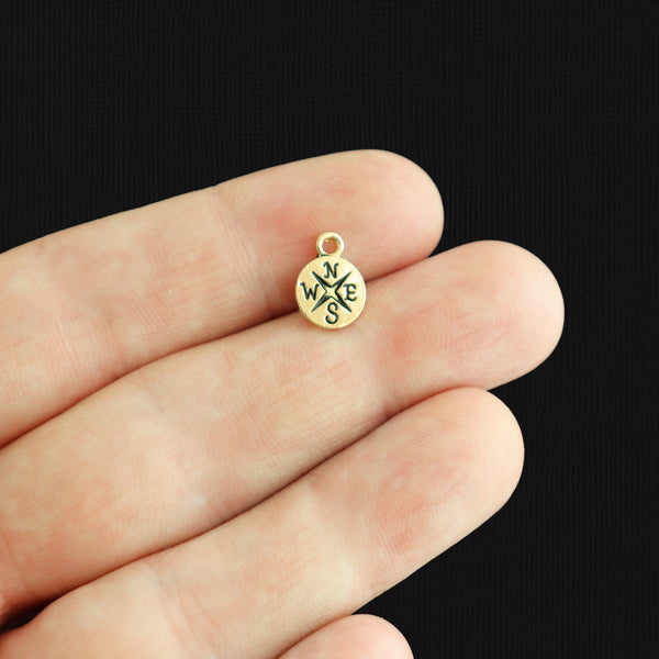 4 Compass Gold Tone Charms - GC183