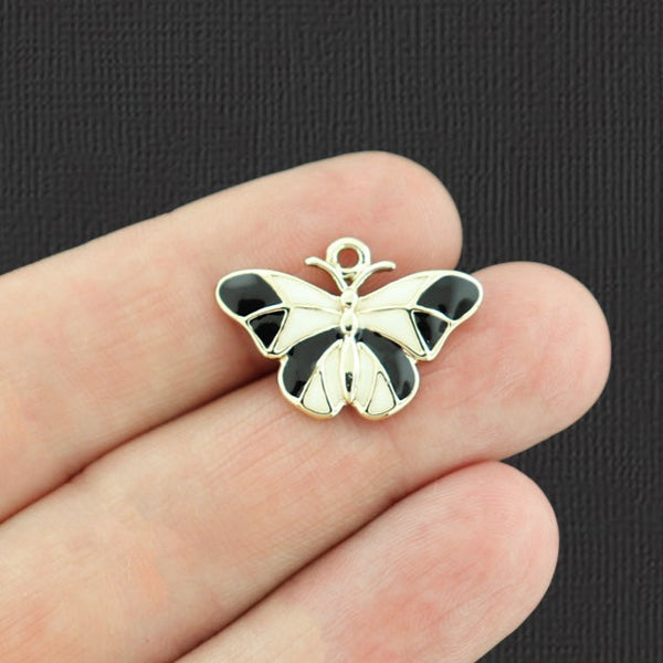 4 breloques papillon en émail doré - E743