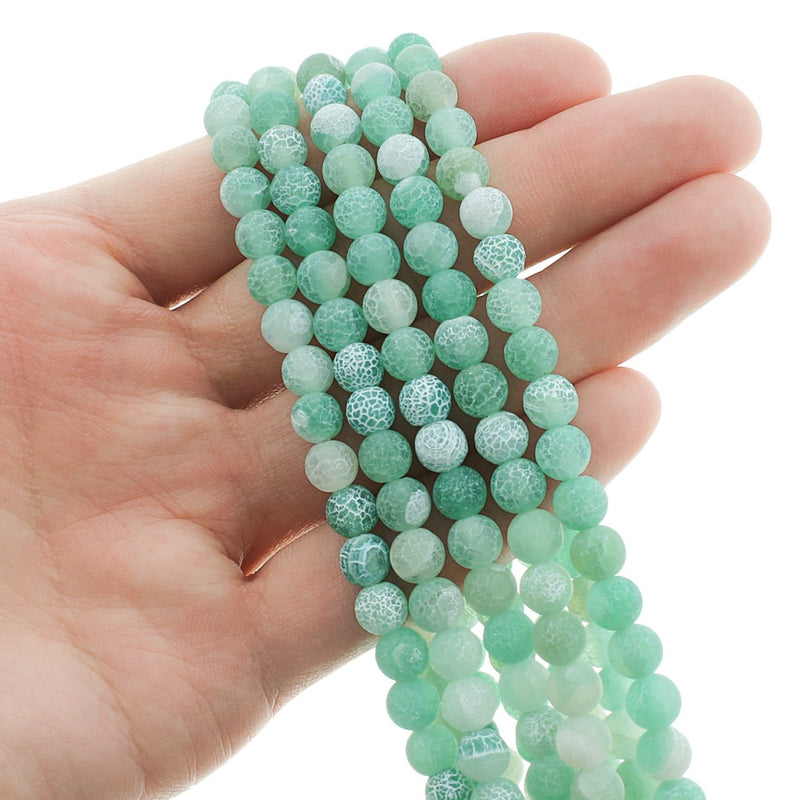Perles rondes en agate naturelle 6 mm - Craquelé turquoise patiné - 1 brin 64 perles - BD313
